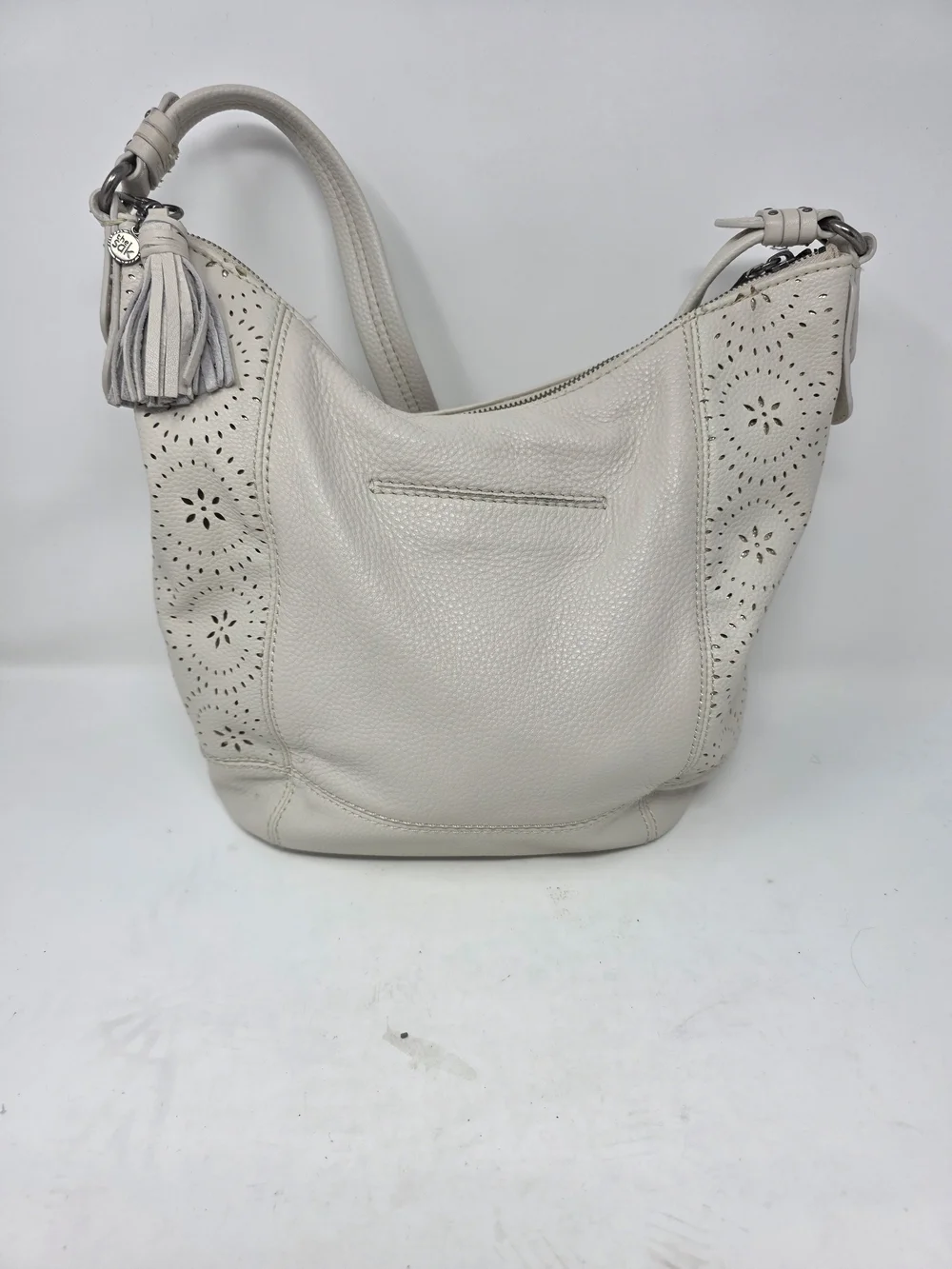 ​The Sak Off White Pebbled Leather Hobo Bag Perforated Cutout Tassel